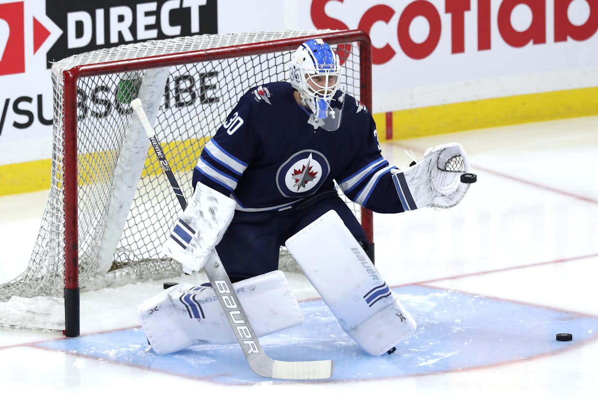 Laurent Brossoit makes 29 saves, Jets beat Canucks 2-0 - WTOP News