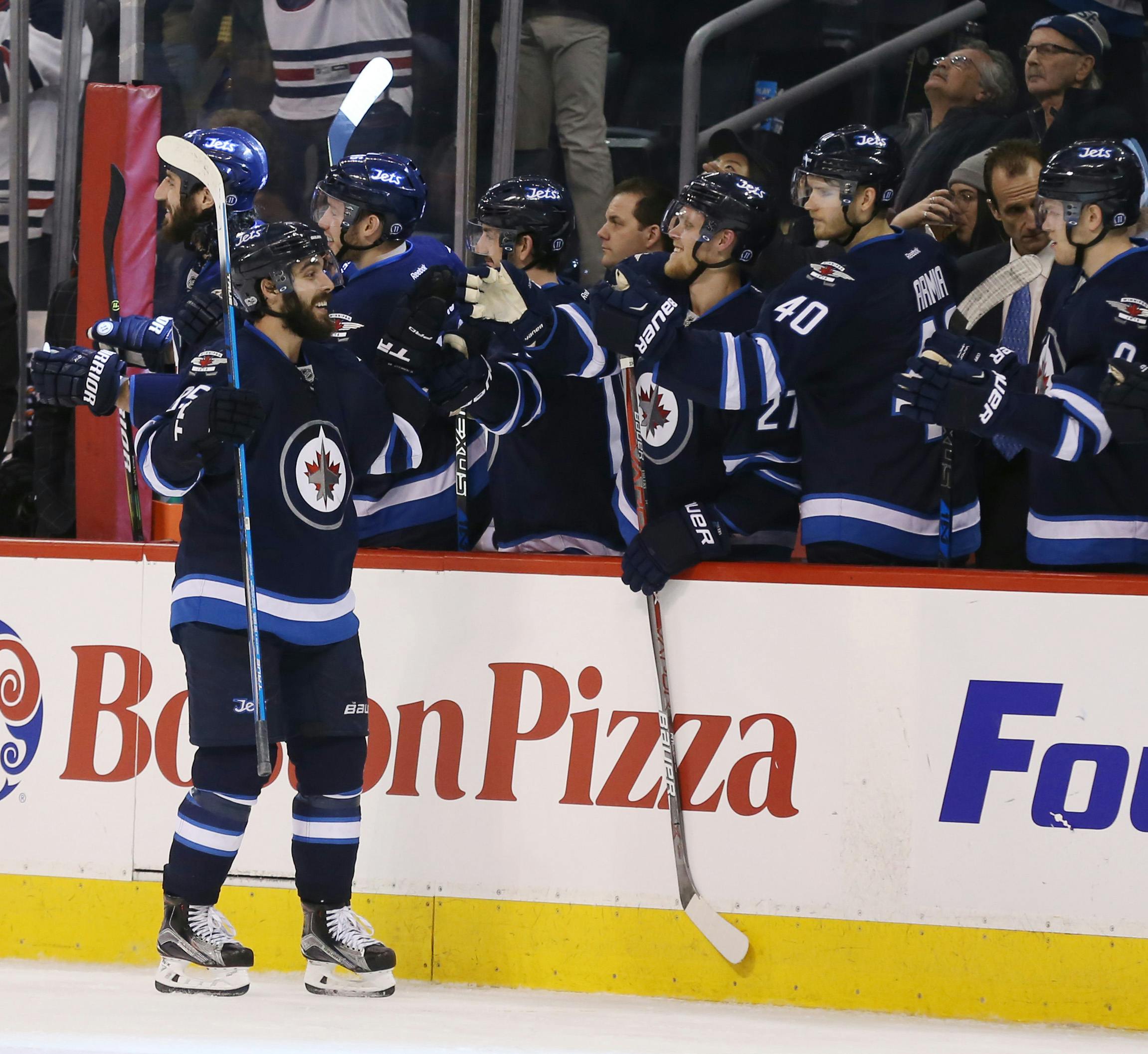 Mar 21, 2017; Winnipeg, Manitoba, CAN; Winnipeg Jets center Mathieu Perreault (85) celebrates with teammates after scoring a goal during the third period against the Philadelphia Flyers at MTS Centre. Winnipeg Jets win 3-2. Mandatory Credit: Bruce Fedyck-USA TODAY Sports