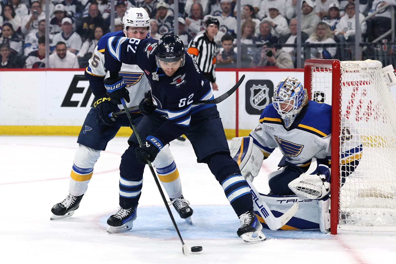 Winnipeg Jets right wing Nino Niederreiter (62) lines up a shot on St. Louis Blues goaltender Jordan Binnington (50) in the second period in game two of the first round of the 2025 Stanley Cup Playoffs at Canada Life Centre
