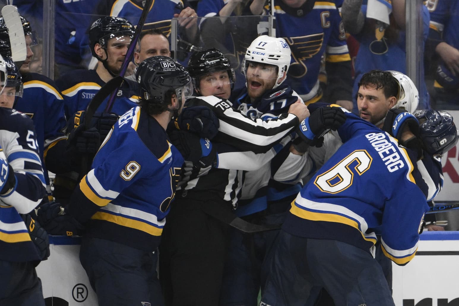 Winnipeg Jets center Adam Lowry (17) battles with St. Louis Blues left wing Alexandre Texier (9) during the third period in game four of the first round of the 2025 Stanley Cup Playoffs at Enterprise Center.